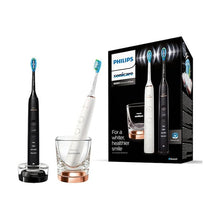 RESIGILAT: Set 2 periute electrice sonice Philips Sonicare DiamondClean 9000 HX9914/61, functie BrushSync, 4 moduri de periere, 3 nivele de intensitate, senzor de presiune, 4 capete de periere, 2 baze cu rol de incarcare, Negru / Rose gold